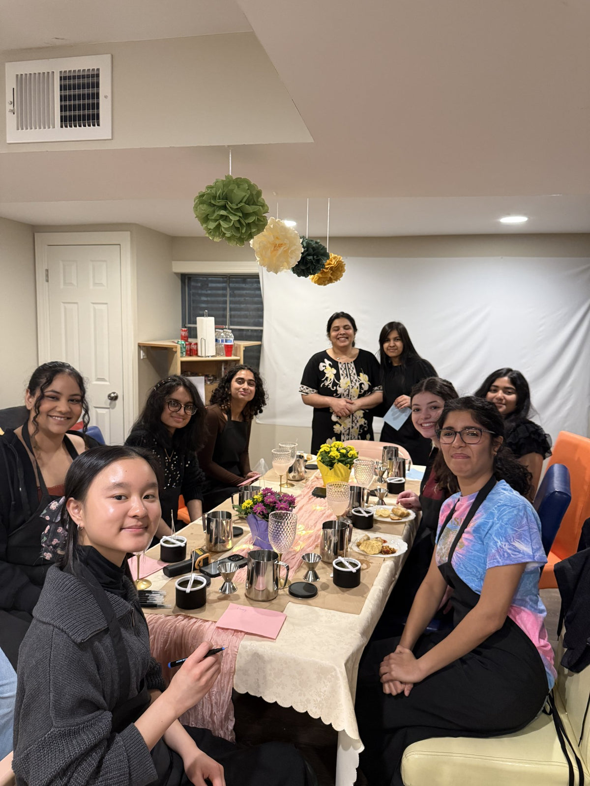 Guests pouring soy candles together at a Sweet U Candles workshop in Buffalo Grove